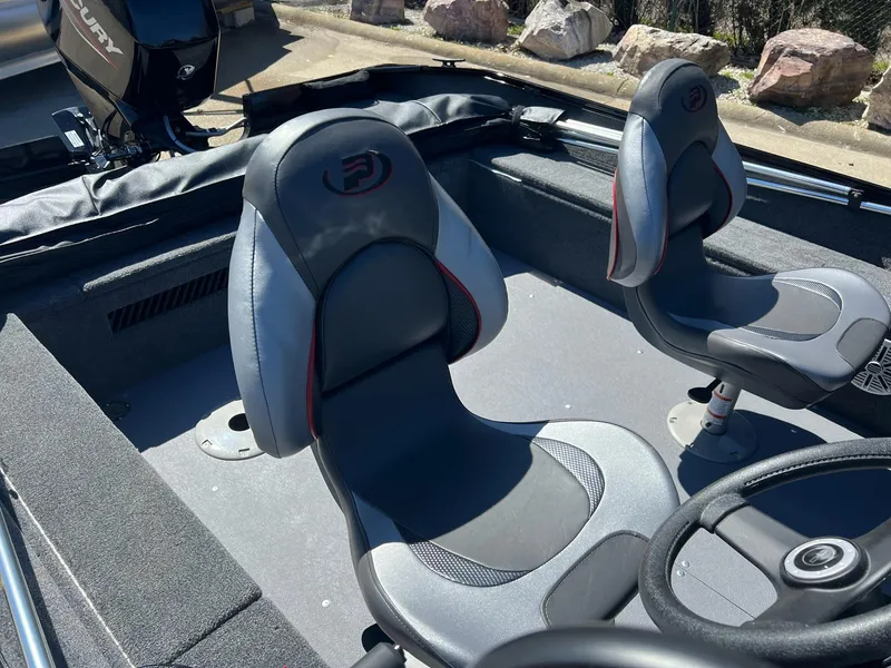 Slide: The Image of 2024 Princecraft Holiday 162 DLX WS MAX boat interior with two seats and steering wheel. - 10