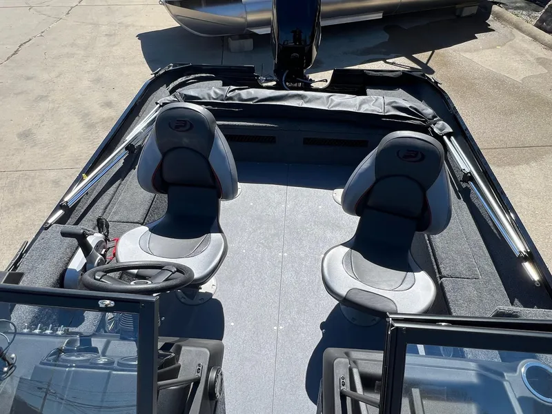 Slide: The Image of 2024 Princecraft Holiday 162 DLX WS MAX boat interior with two seats and steering wheel. - 13