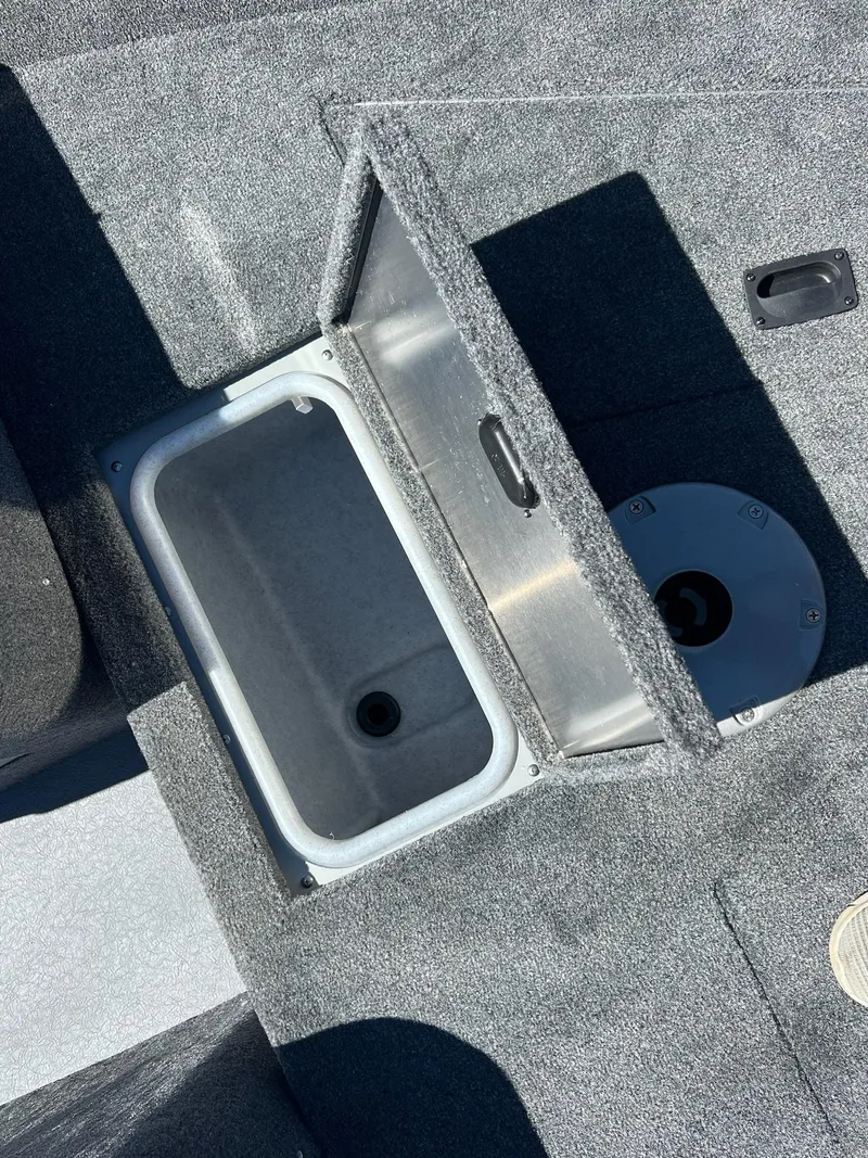 Slide: The Image of 2024 Princecraft Holiday 162 DLX WS MAX boat interior storage compartment. - 15