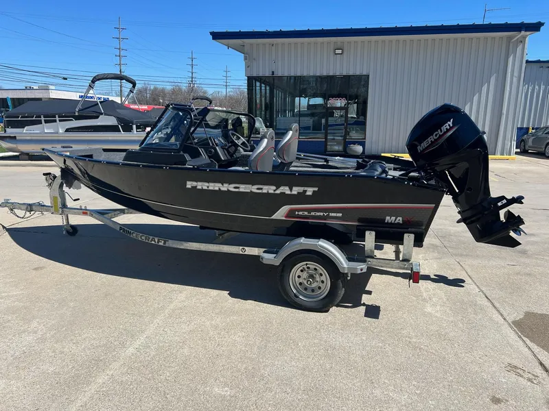 Slide: The Image of 2024 Princecraft Holiday 162 DLX WS MAX boat on trailer, outdoor display. - 4