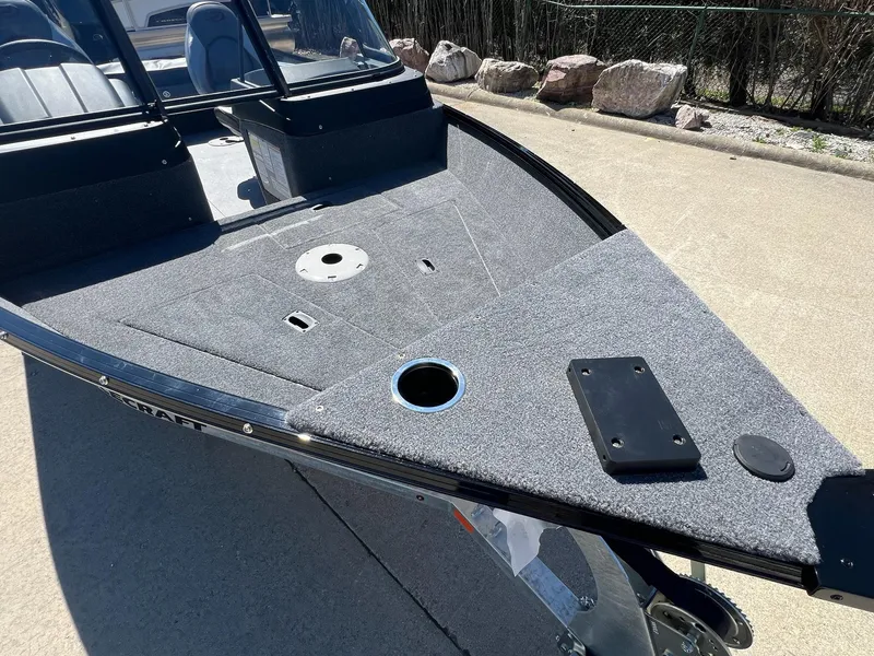 Slide: The Image of 2024 Princecraft Holiday 162 DLX WS MAX boat, featuring a spacious deck and sleek design. - 7