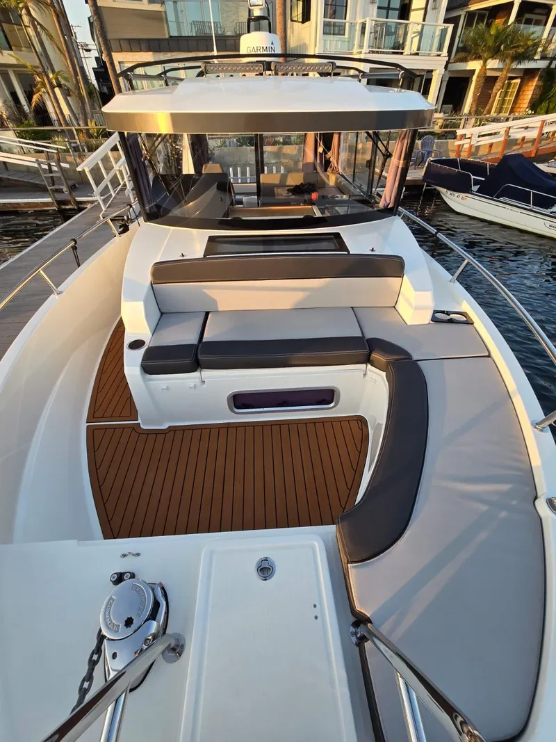 Slide: The Image of 2020 Jeanneau NC 895 Sport boat with spacious deck and seating area. - 23
