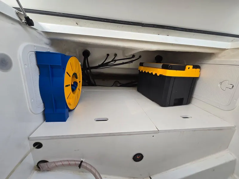 Slide: The Image of Storage compartment in a 2020 Jeanneau NC 895 Sport boat with equipment and wiring. - 33