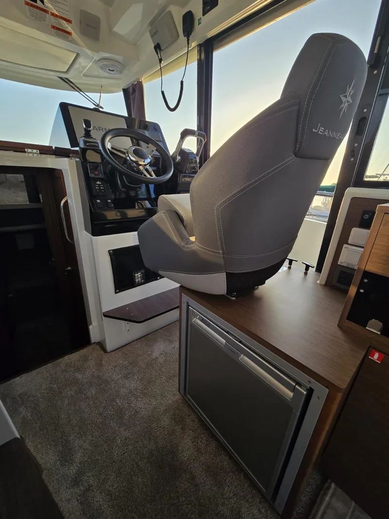 Slide: The Image of Interior of 2020 Jeanneau NC 895 Sport boat with helm and seating area. - 35