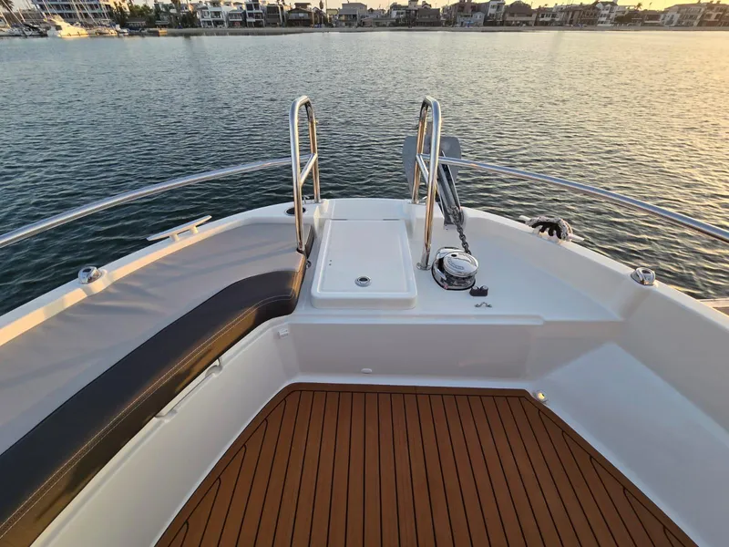 Slide: The Image of 2020 Jeanneau NC 895 Sport boat deck with scenic waterfront view. - 37