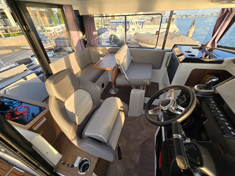 Slide: The Image of Interior of 2020 Jeanneau NC 895 Sport boat with seating and steering area. - 39