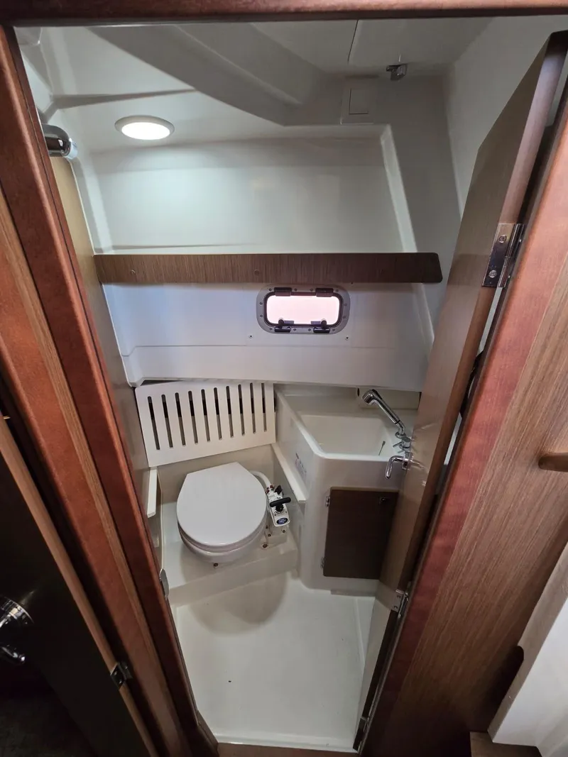 Slide: The Image of 2020 Jeanneau NC 895 Sport boat bathroom with compact design and modern fixtures. - 43