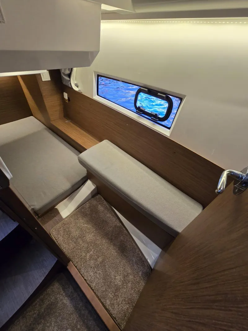 Slide: The Image of Interior cabin of 2020 Jeanneau NC 895 Sport with cozy seating and window view. - 44