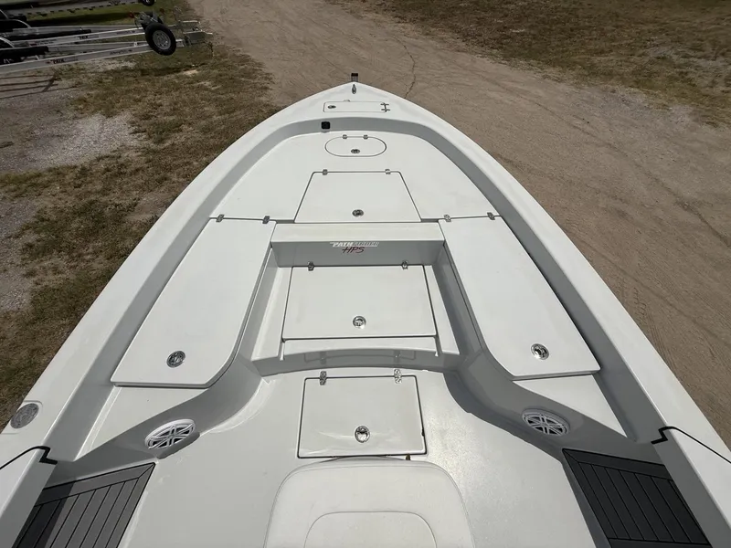 Slide: The Image of 2024 Pathfinder 2600 HPS boat deck with storage compartments and speakers. - 11