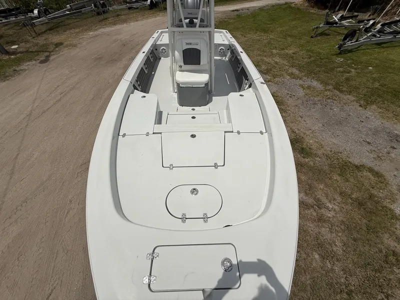 Slide: The Image of 2024 Pathfinder 2600 HPS boat, top view, on dry land, showcasing deck layout. - 12