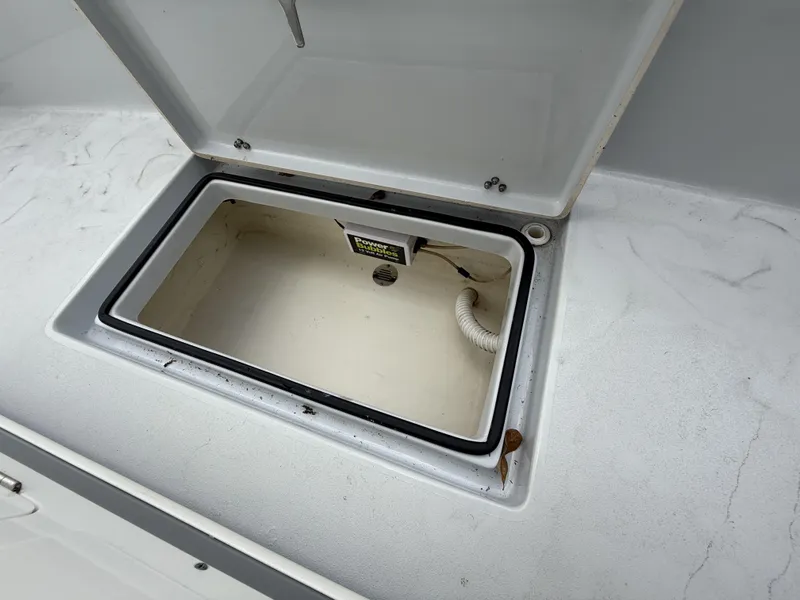 Slide: The Image of Open storage compartment on 2024 Pathfinder 2600 HPS boat deck. - 17