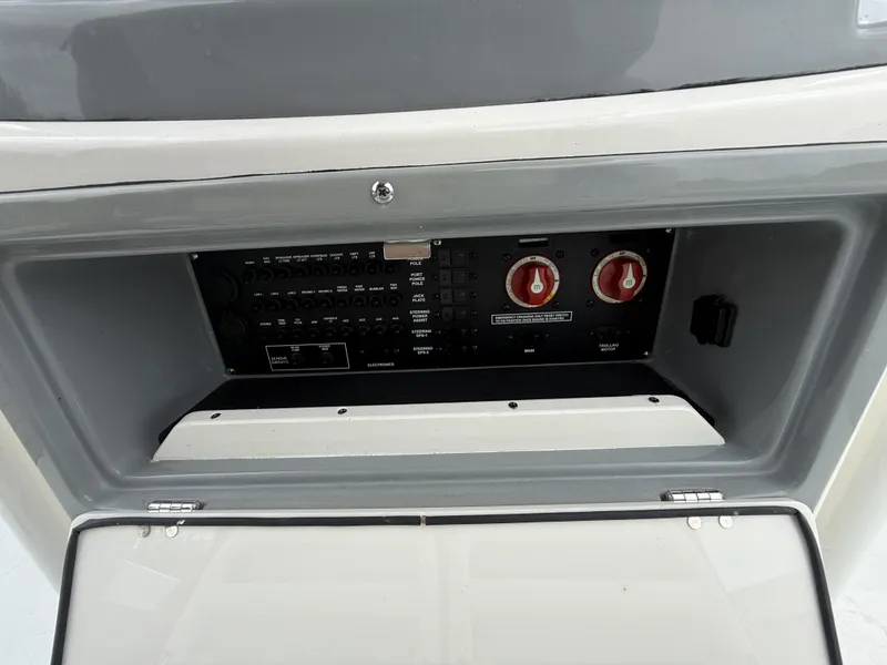 Slide: The Image of 2024 Pathfinder 2600 HPS control panel with switches and dials in a compartment. - 18
