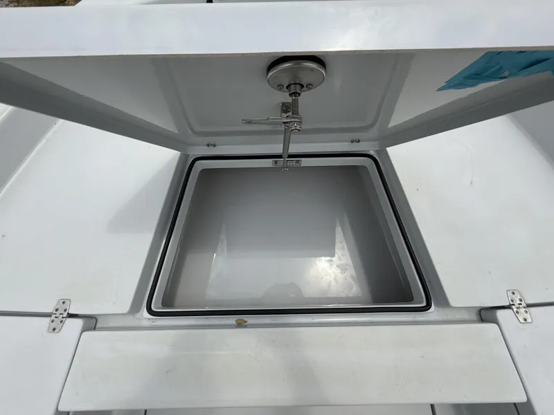 Slide: The Image of Open storage compartment on 2024 Pathfinder 2600 HPS boat, showcasing interior space. - 23