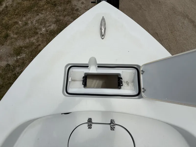 Slide: The Image of 2024 Pathfinder 2600 HPS boat deck with open storage compartment. - 24