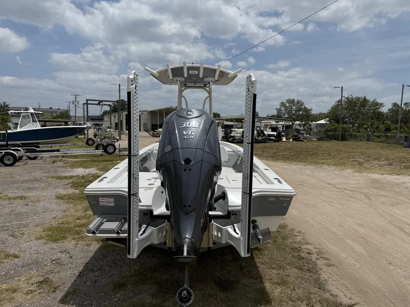 Slide: The Image of 2024 Pathfinder 2600 HPS boat with powerful outboard motor, parked outdoors. - 26