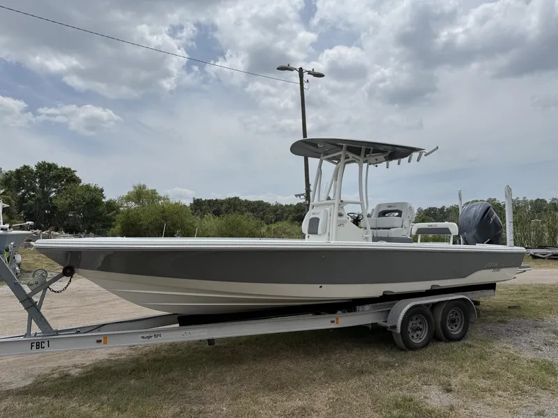 Slide: The Image of 2024 Pathfinder 2600 HPS boat on trailer under cloudy sky. - 29