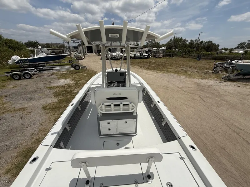 Slide: The Image of 2024 Pathfinder 2600 HPS boat on display at a marina under a cloudy sky. - 31