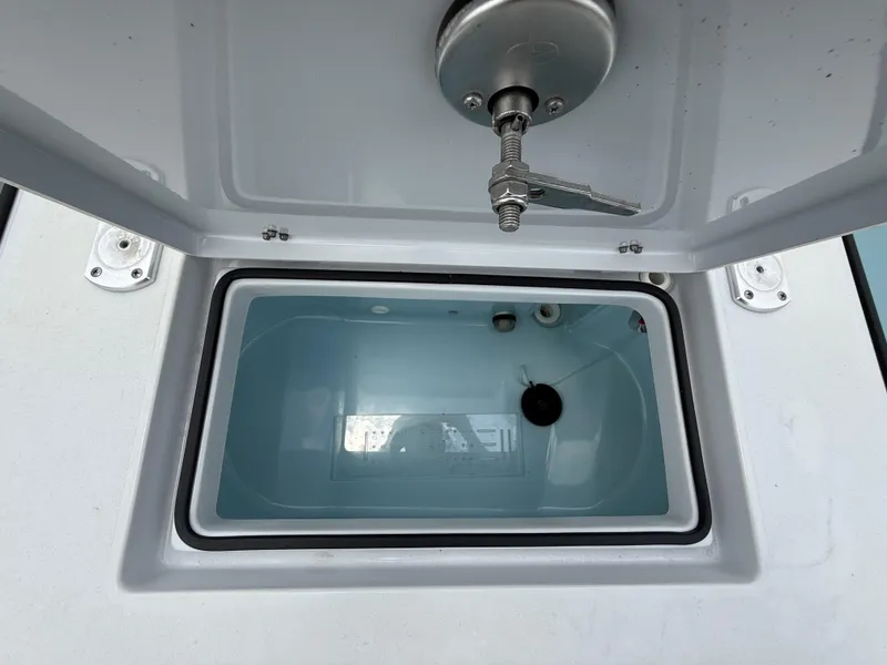 Slide: The Image of Open storage compartment on 2024 Pathfinder 2600 HPS boat, showcasing interior details. - 37