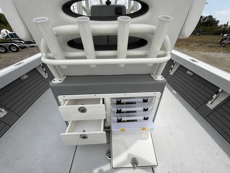 Slide: The Image of 2024 Pathfinder 2600 HPS boat with storage drawers and rod holders on deck. - 40