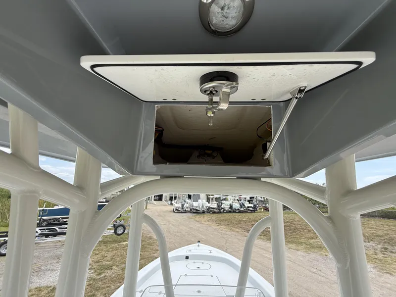 Slide: The Image of 2024 Pathfinder 2600 HPS boat interior view with open hatch and light fixture. - 42