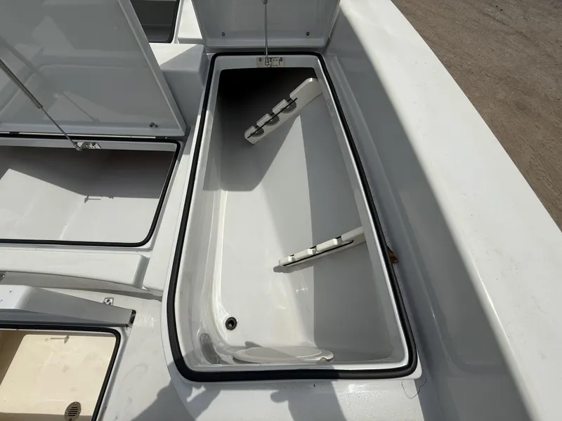 Slide: The Image of Open storage compartment on 2024 Pathfinder 2600 HPS boat, showcasing interior space. - 45