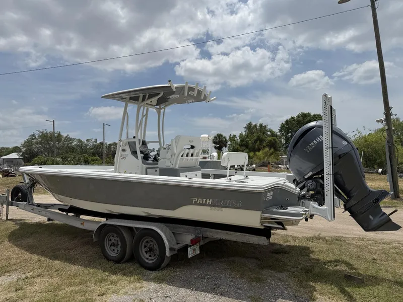 Slide: The Image of 2024 Pathfinder 2600 HPS boat on trailer, featuring Yamaha outboard motor, under cloudy sky. - 5