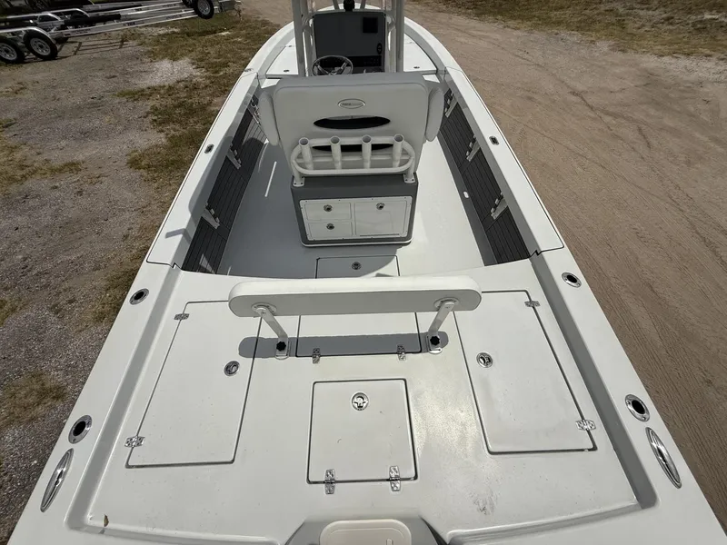 Slide: The Image of 2024 Pathfinder 2600 HPS boat interior with storage compartments and seating. - 7