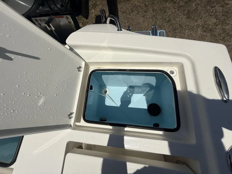 Slide: The Image of 2024 Pathfinder 2500 Hybrid boat livewell with open lid, showing interior details. - 17