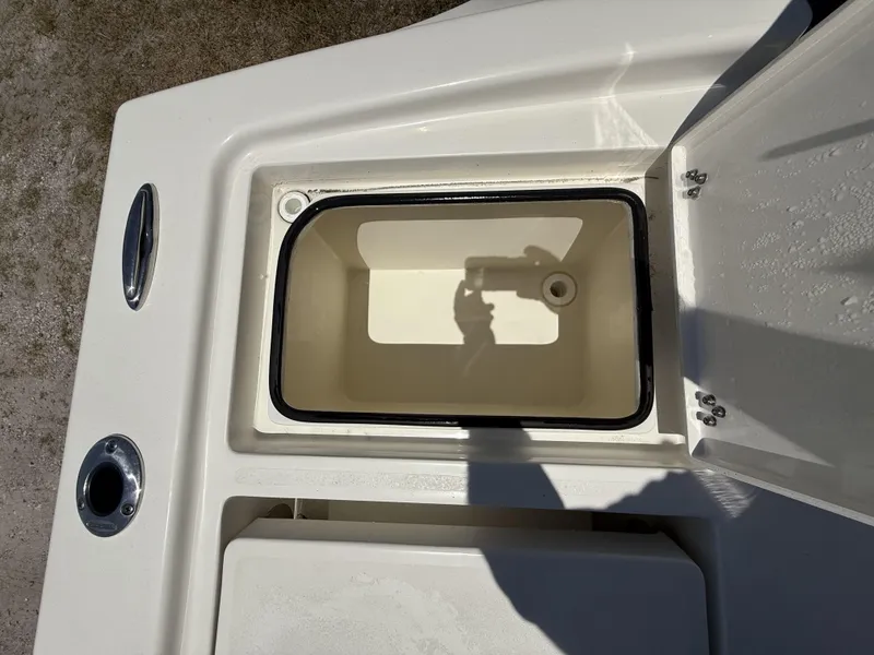 Slide: The Image of Open storage compartment on 2024 Pathfinder 2500 Hybrid boat, showing interior details. - 18