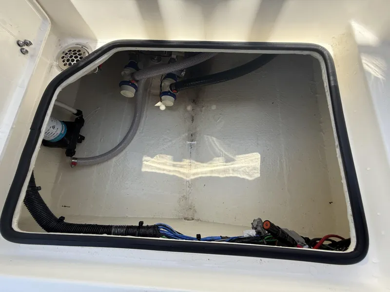 Slide: The Image of 2024 Pathfinder 2500 Hybrid boat compartment with hoses and wiring. - 20