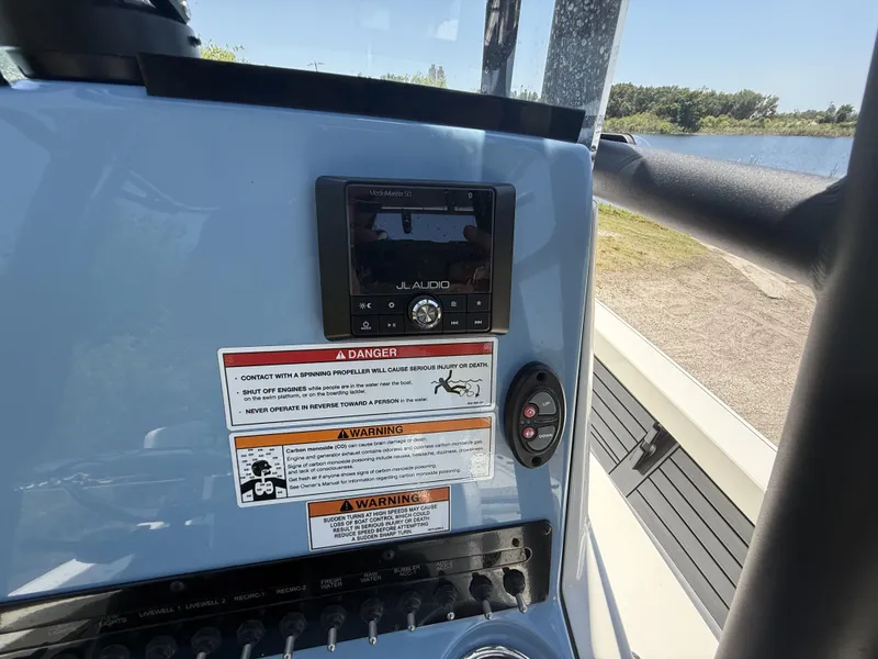 Slide: The Image of 2024 Pathfinder 2500 Hybrid dashboard with JL Audio system and safety warnings. - 22