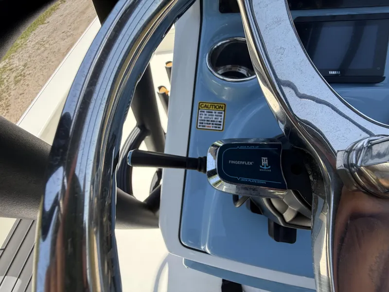 Slide: The Image of 2024 Pathfinder 2500 Hybrid steering wheel and controls, featuring FingerFlex marine technology. - 23