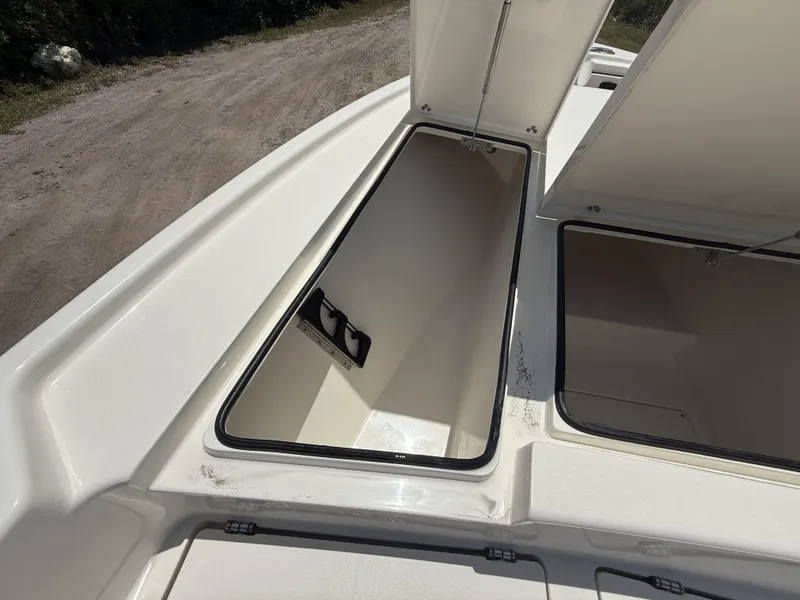 Slide: The Image of 2024 Pathfinder 2500 Hybrid boat storage compartments open on deck. - 24
