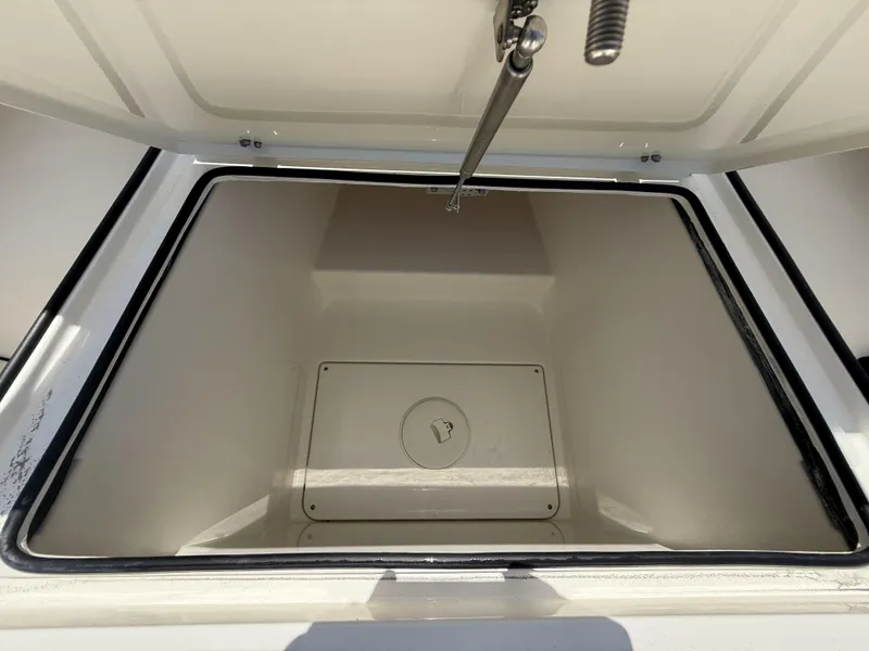 Slide: The Image of Open storage compartment in 2024 Pathfinder 2500 Hybrid boat. - 25