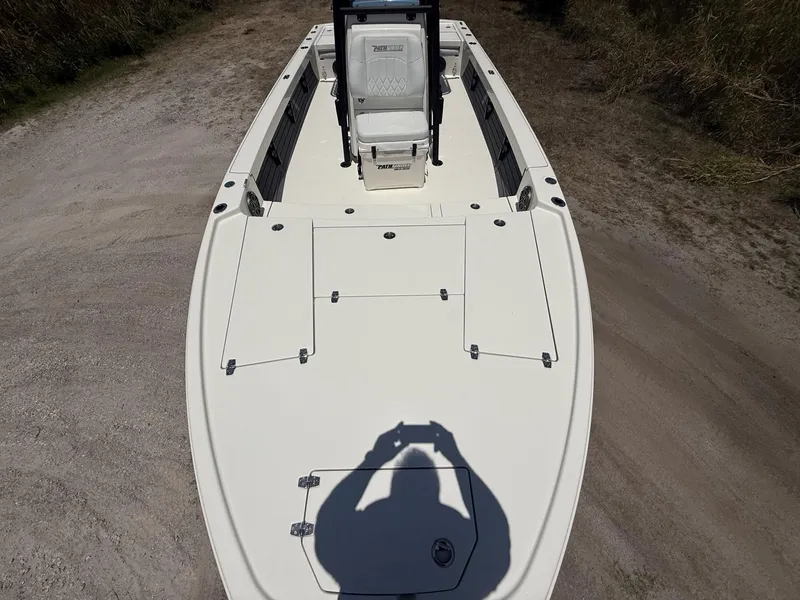 Slide: The Image of 2024 Pathfinder 2500 Hybrid boat deck with storage compartments and seating. - 34