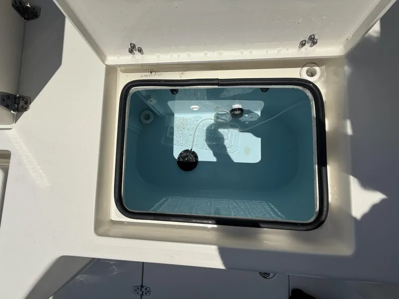 Slide: The Image of Open livewell compartment on 2024 Pathfinder 2500 Hybrid boat, showing interior details. - 37