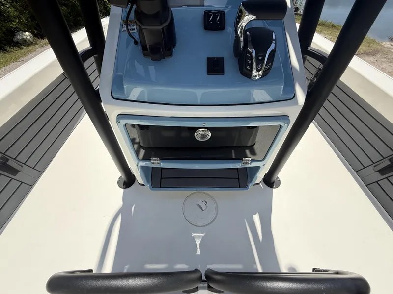 Slide: The Image of 2024 Pathfinder 2500 Hybrid boat console with controls and storage compartment. - 40