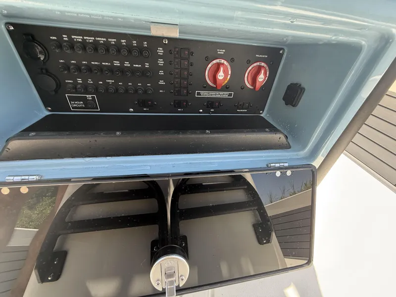 Slide: The Image of Control panel of 2024 Pathfinder 2500 Hybrid boat with switches and dials. - 41