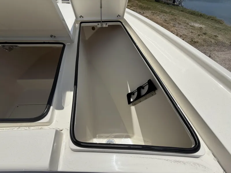 Slide: The Image of Open storage compartment on 2024 Pathfinder 2500 Hybrid boat, showcasing spacious interior design. - 45