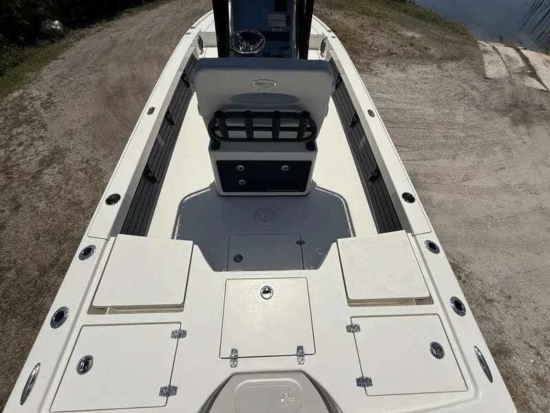 Slide: The Image of 2024 Pathfinder 2500 Hybrid boat interior, featuring spacious deck and seating area. - 7