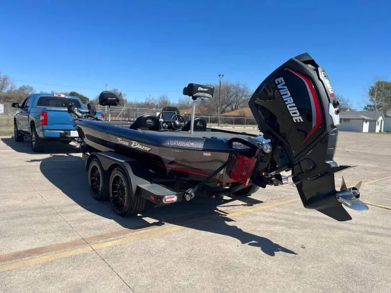 Slide: The Image of 2020 Blazer 625 Pro Elite boat with Evinrude engine on trailer. - 4