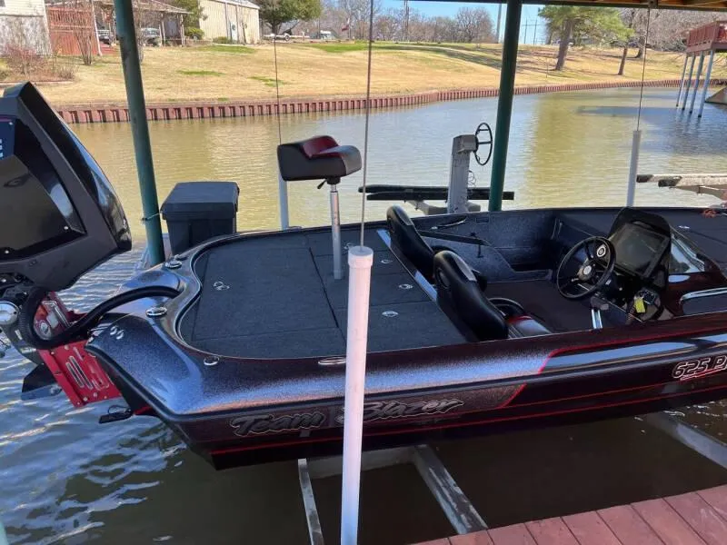 Slide: The Image of Evinrude display on 2020 Blazer 625 Pro Elite showing temperature, hours, and voltage. - 8