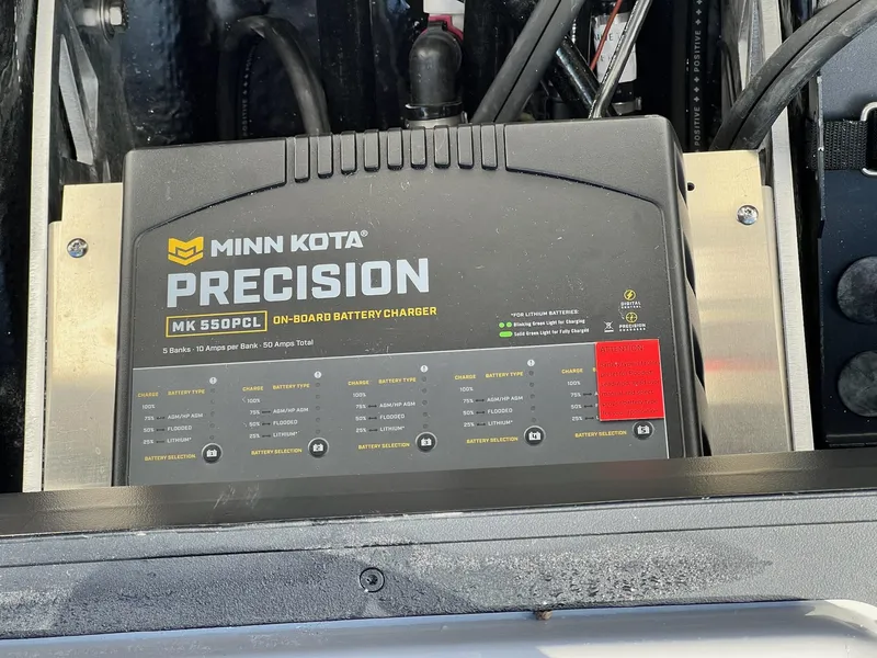 Slide: The Image of Minn Kota Precision MK 550PCL on-board battery charger in 2025 Skeeter ZXR 21 boat. - 11