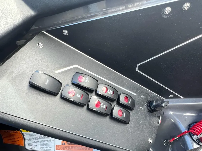 Slide: The Image of Control panel of 2025 Skeeter ZXR 21 boat with labeled switches. - 19