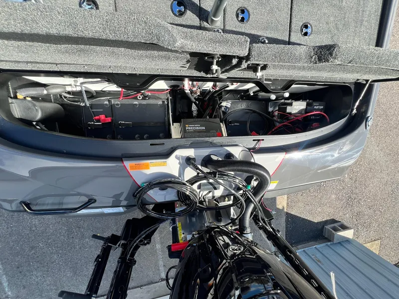 Slide: The Image of 2025 Skeeter ZXR 21 boat interior showing battery and wiring setup. - 20