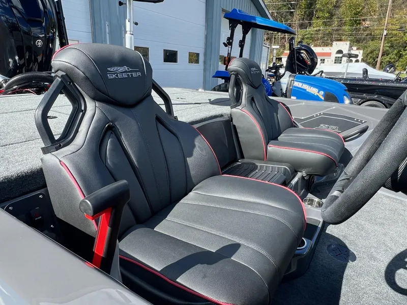Slide: The Image of Skeeter ZXR 21 boat seats, 2025 model, featuring sleek black design with red accents. - 21