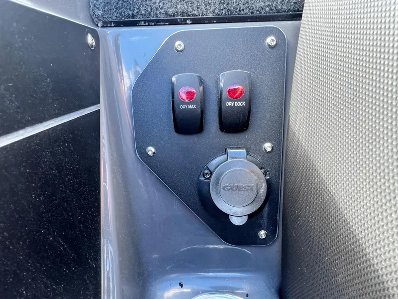 Slide: The Image of Control panel of 2025 Skeeter ZXR 21 boat with switches and socket. - 23