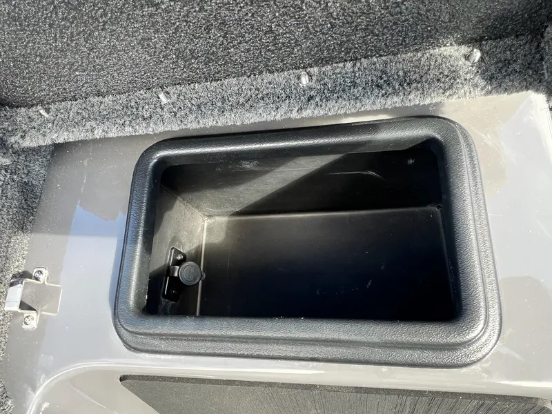 Slide: The Image of 2025 Skeeter ZXR 21 storage compartment, open and empty. - 28