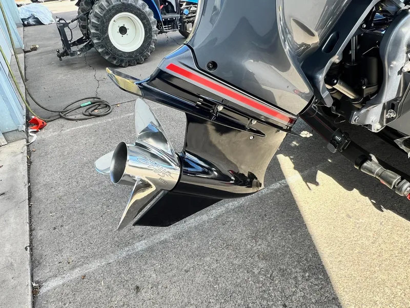 Slide: The Image of Close-up of a 2025 Skeeter ZXR 21 boat motor with a shiny propeller. - 29