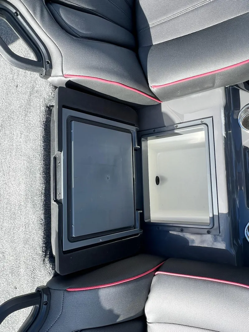 Slide: The Image of 2025 Skeeter ZXR 21 boat interior with storage compartment and seating. - 31